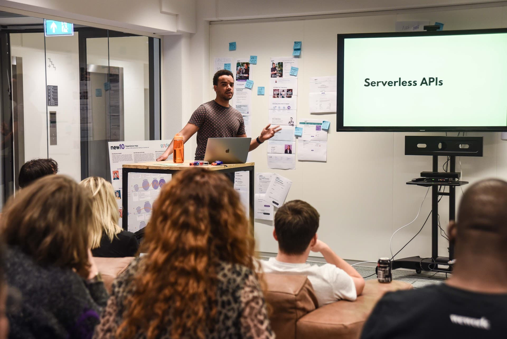 Ricardo presenting Serverless APIs to colleagues at the New10 office in Amsterdam.